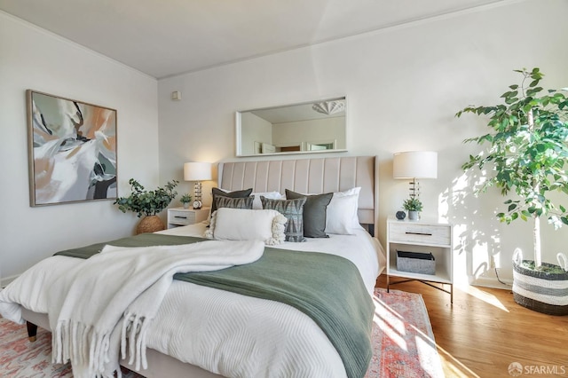 bedroom with wood finished floors