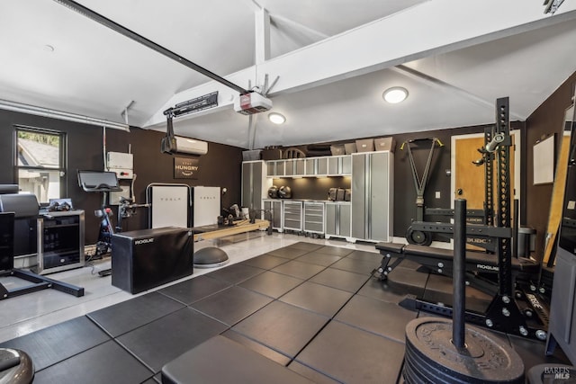 workout room featuring lofted ceiling and an AC wall unit