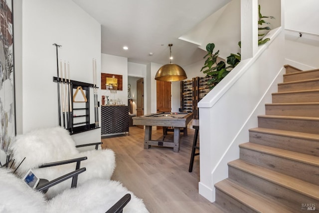 interior space with wood finished floors and recessed lighting
