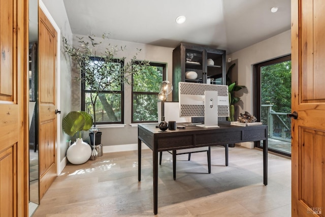 office space with baseboards and recessed lighting