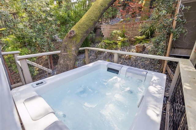 exterior space featuring a hot tub