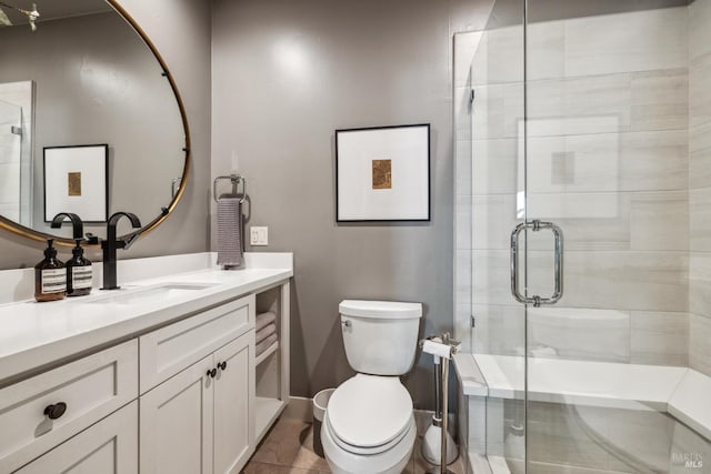 full bathroom with a shower stall, toilet, and vanity
