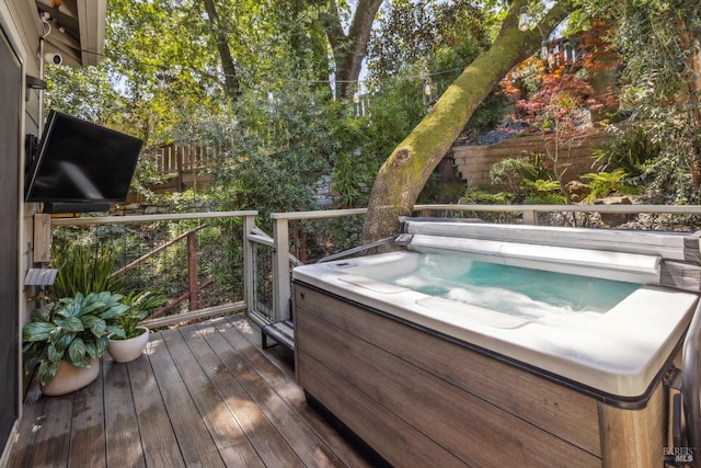 wooden terrace with a hot tub