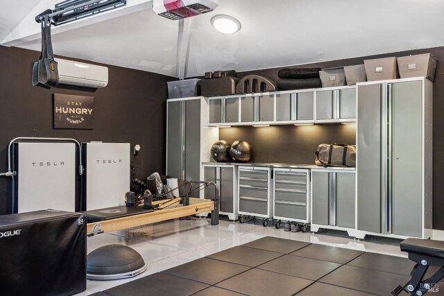 garage with a wall mounted air conditioner and a garage door opener