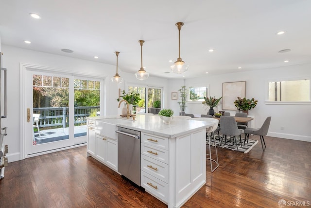 192 Yerba Buena Ave, San Francisco, CA 94127 - kitchen with stainless steel dishwasher, a sink, a breakfast bar area, white cabinets, and recessed lighting