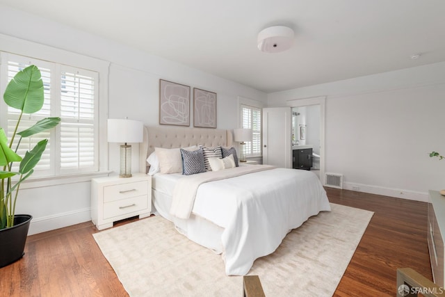 192 Yerba Buena Ave, San Francisco, CA 94127 - bedroom with baseboards, wood finished floors, and connected bathroom