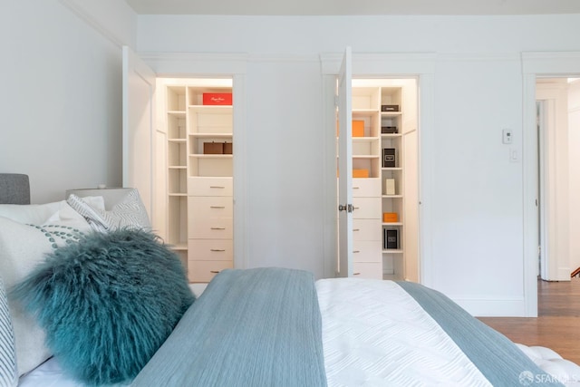 192 Yerba Buena Ave, San Francisco, CA 94127 - bedroom with a walk in closet, wood finished floors, and a closet