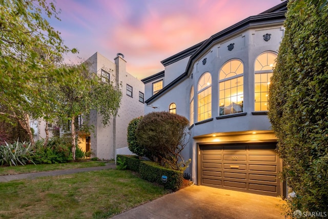 192 Yerba Buena Ave, San Francisco, CA 94127 - view of front of home with stucco siding, a garage, and driveway