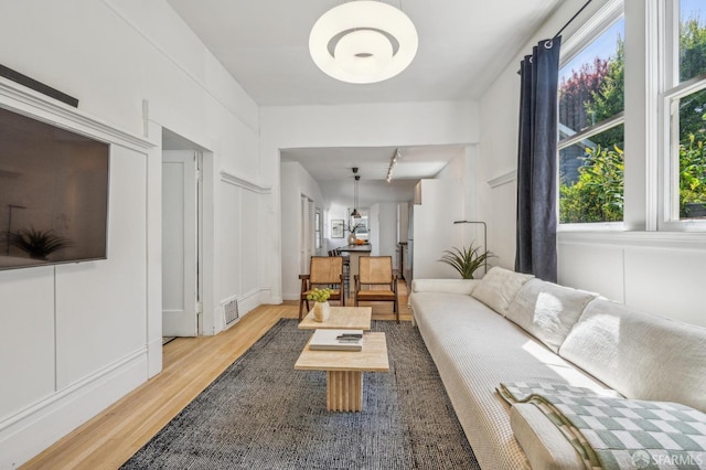 411 Clipper St, San Francisco, CA 94114 - living room featuring light wood finished floors and plenty of natural light