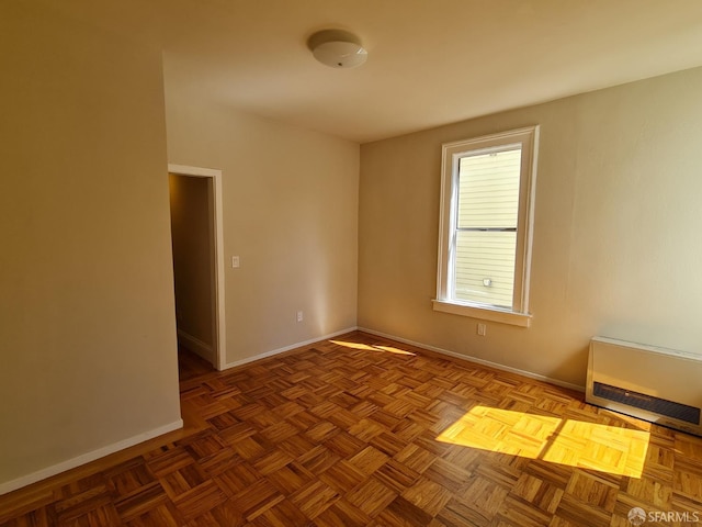 spare room with parquet flooring