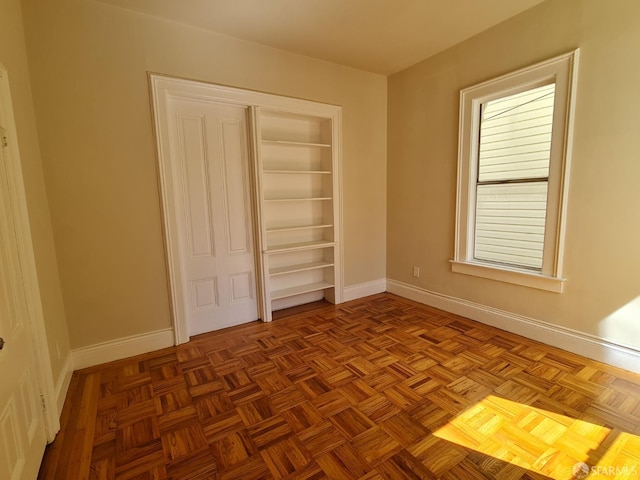 unfurnished bedroom with light parquet floors