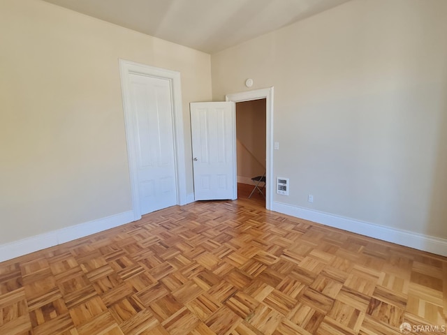 empty room featuring light parquet flooring