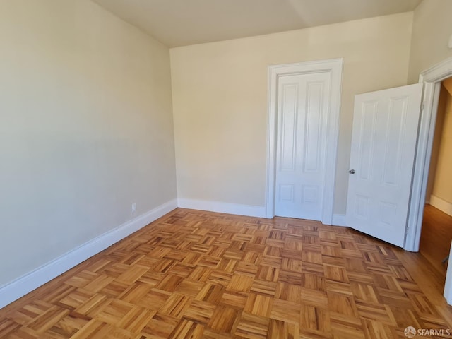 unfurnished bedroom featuring light parquet flooring