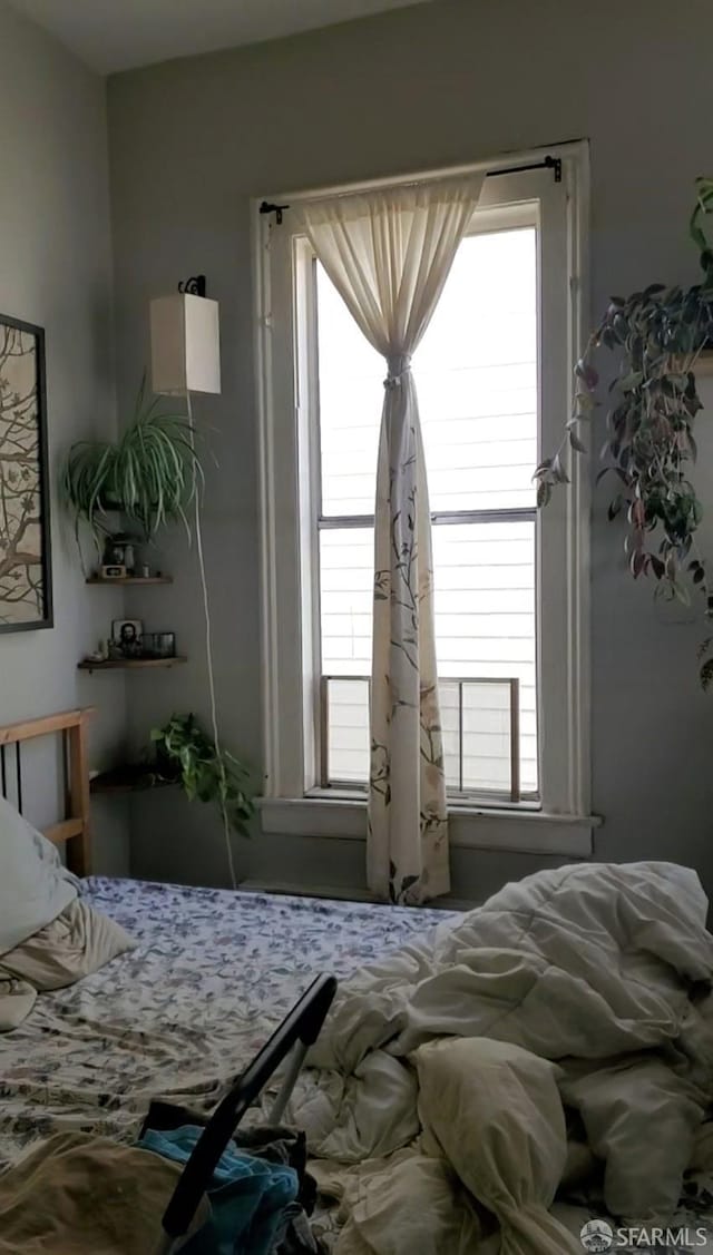 bedroom with multiple windows