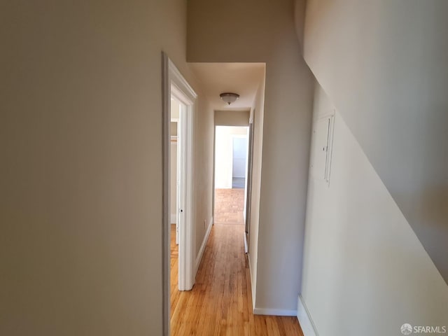 corridor with light wood-type flooring