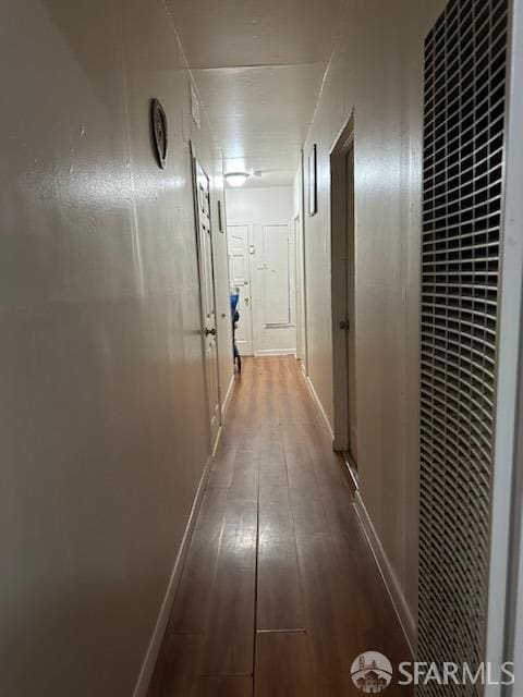 corridor featuring hardwood / wood-style floors