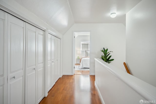 212 Kavanaugh Way, Pacifica, CA 94044 - corridor with light wood-type flooring and vaulted ceiling
