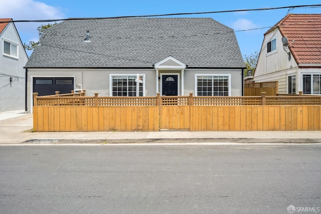 212 Kavanaugh Way, Pacifica, CA 94044 - view of front of home featuring a fenced front yard, a shingled roof, stucco siding, and a garage