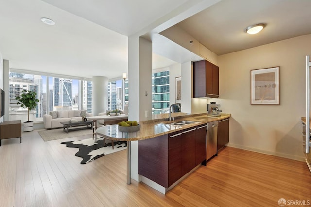425 1st St Unit 2007, San Francisco, CA 95105 - kitchen with light wood finished floors, plenty of natural light, and a peninsula