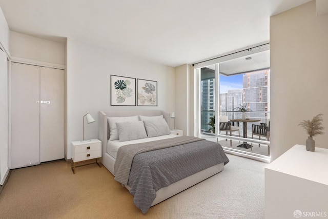 425 1st St Unit 2007, San Francisco, CA 95105 - bedroom with light colored carpet, a wall of windows, and a view of city