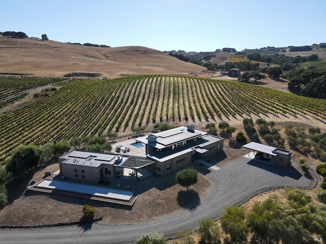 aerial view featuring a rural view and a mountain view