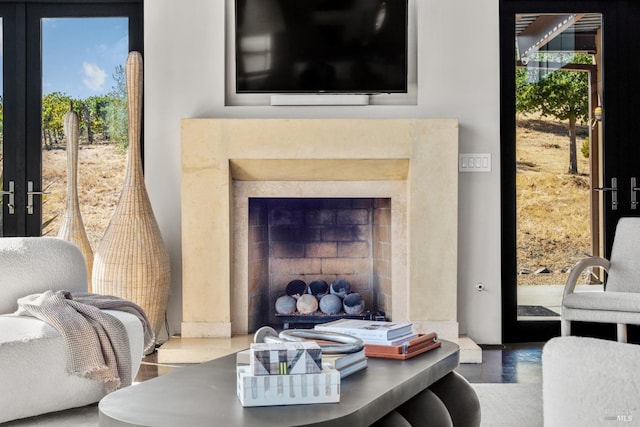 interior space with a high end fireplace and french doors