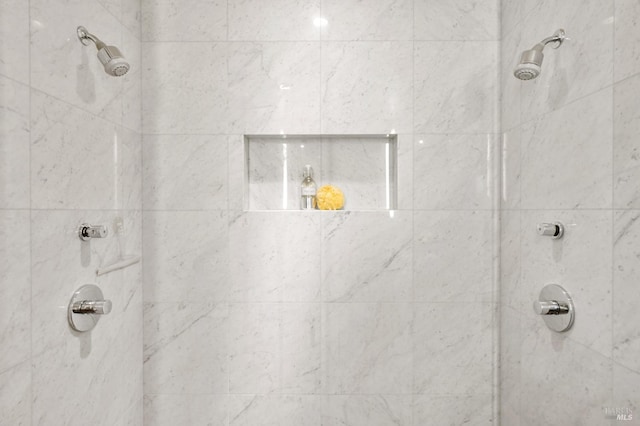 full bath featuring tiled shower