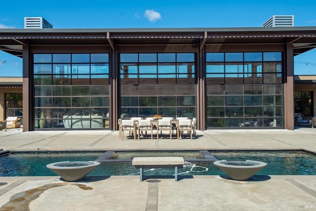 outdoor pool featuring a patio area