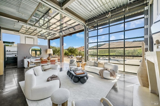 sunroom with an outdoor living space and outdoor dining area