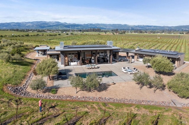 birds eye view of property featuring a rural view and a mountain view