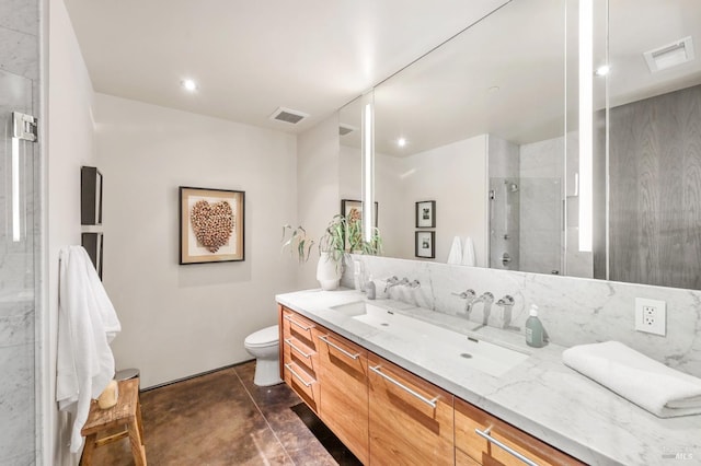 bathroom with a shower stall, visible vents, toilet, a sink, and double vanity
