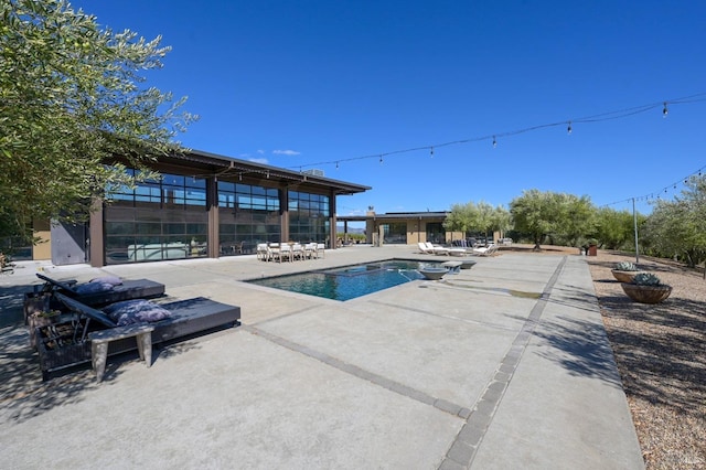 outdoor pool featuring a patio area