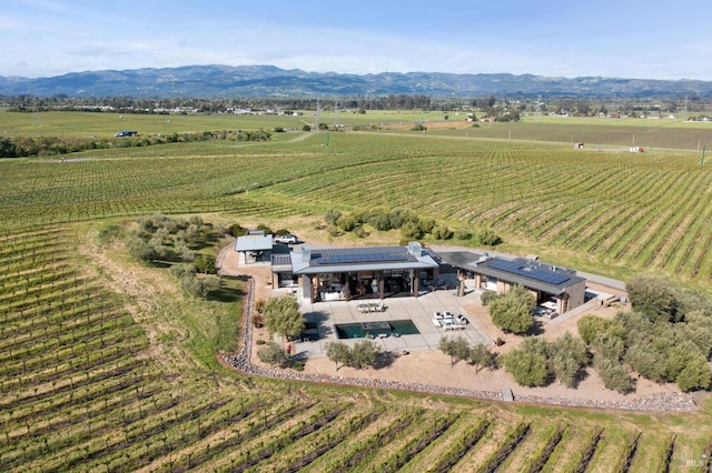 aerial view with a mountain view and a rural view