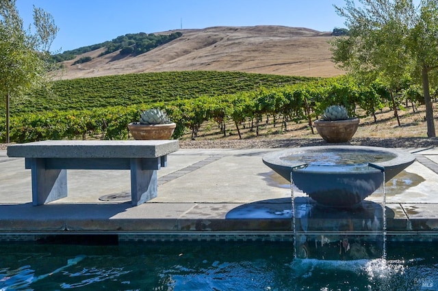 exterior space featuring a rural view and a mountain view