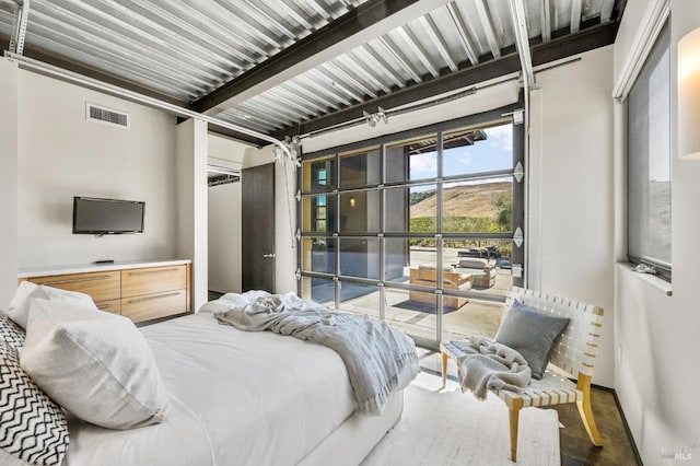 bedroom with french doors and visible vents