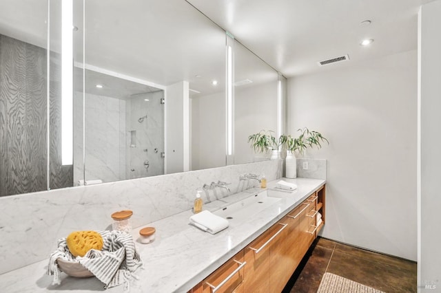 bathroom with visible vents, a walk in shower, vanity, and recessed lighting