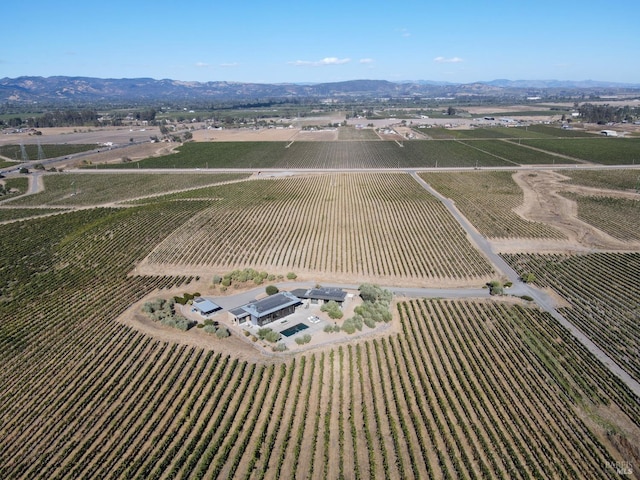 drone / aerial view with a rural view and a mountain view