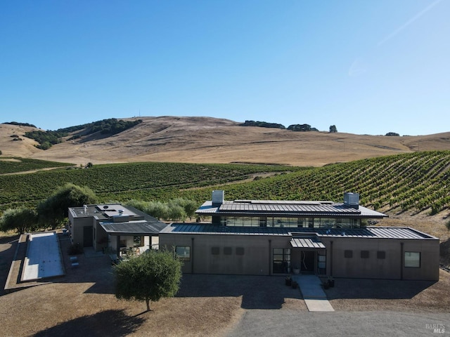exterior space with a rural view and a mountain view