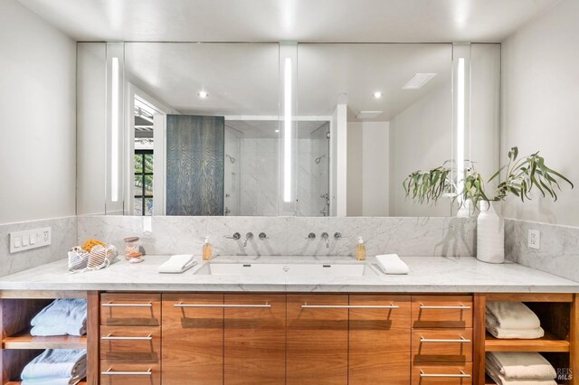 bathroom featuring a shower stall, vanity, and recessed lighting