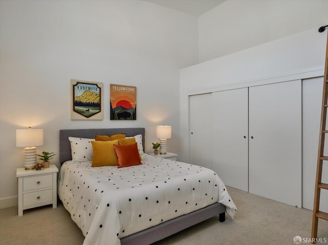 carpeted bedroom featuring a closet