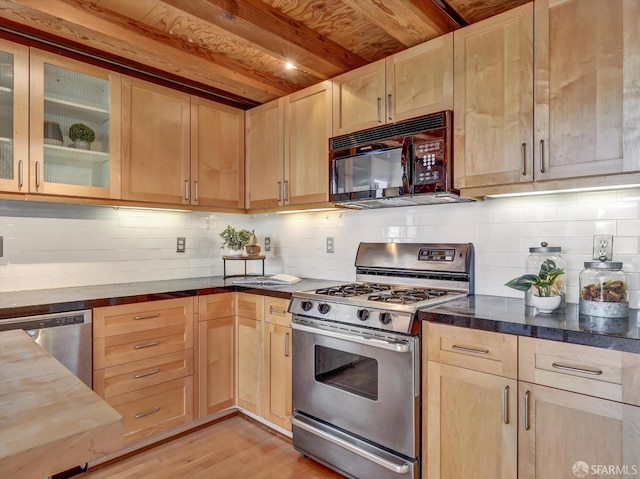 kitchen with stainless steel appliances, light hardwood / wood-style floors, light brown cabinets, and wood counters