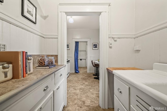 bathroom featuring a wainscoted wall