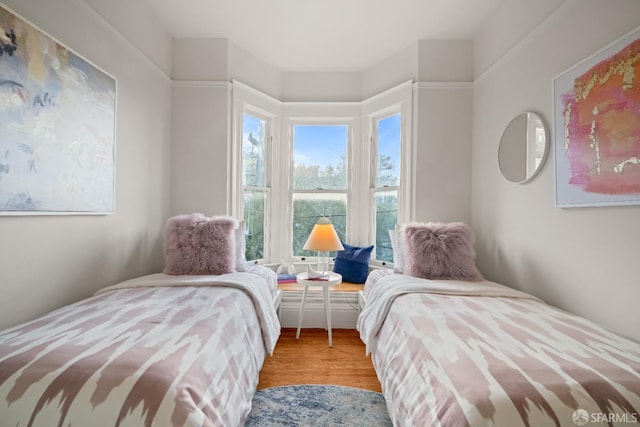 bedroom with wood finished floors