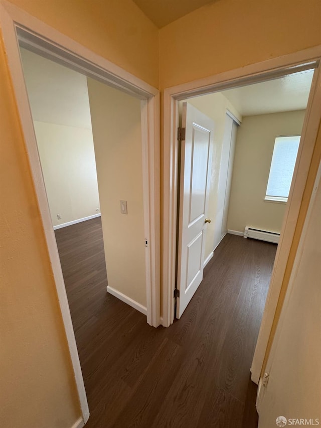 130 Albatross Ct Unit 16, San Francisco, CA 94124 - hall featuring a baseboard radiator, dark wood finished floors, and baseboards