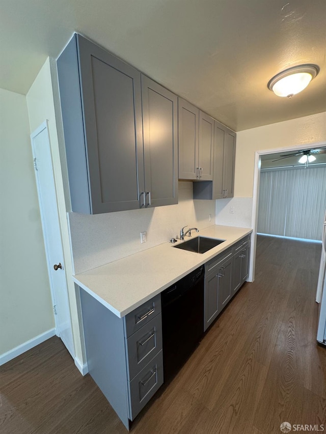 130 Albatross Ct Unit 16, San Francisco, CA 94124 - kitchen featuring black dishwasher, a sink, gray cabinetry, dark wood-type flooring, and light countertops