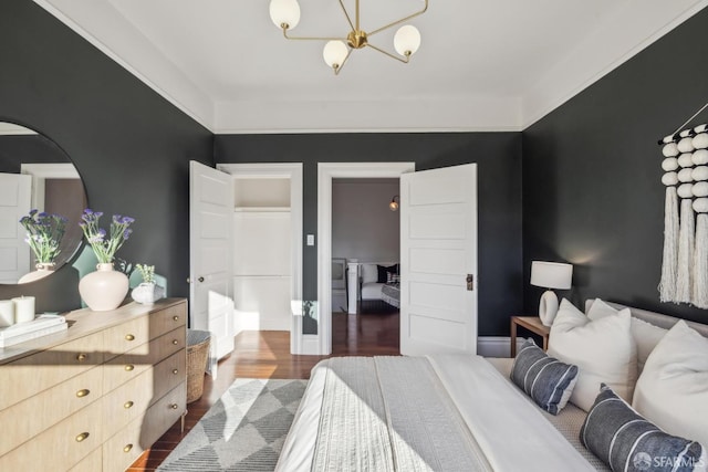 bedroom featuring dark wood-style flooring and baseboards