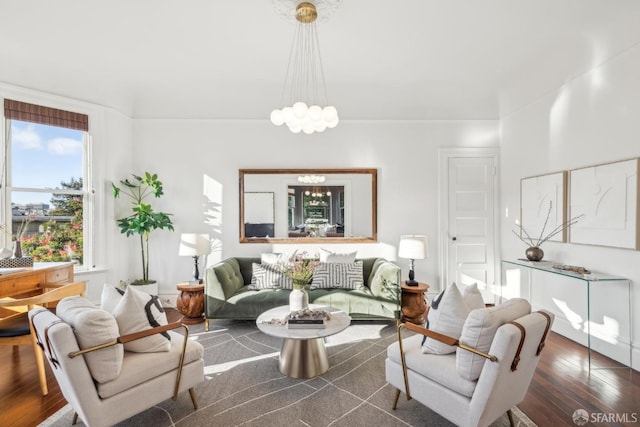 living area with an inviting chandelier and dark wood finished floors