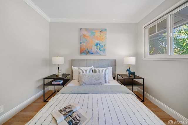 bedroom featuring crown molding and wood-type flooring