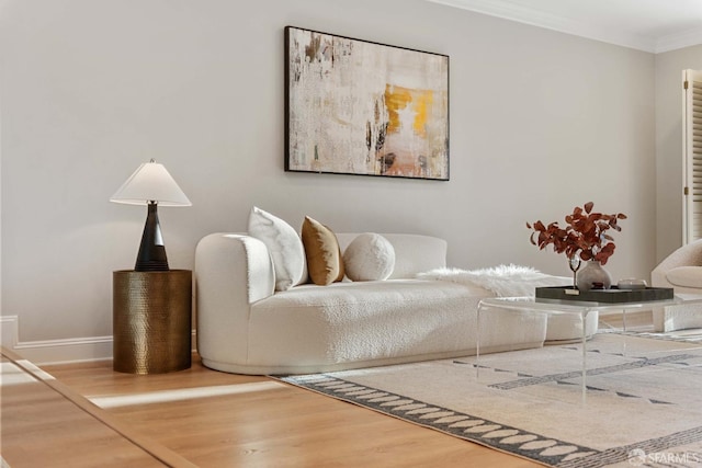 living room with hardwood / wood-style floors and ornamental molding