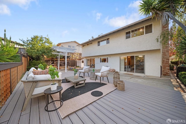 wooden terrace with an outdoor living space and a pergola